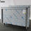 Neutraler Arbeitsschrank mit Schiebetüren und Aufkantung, 1200x600 mm - BESCHÄDIGT